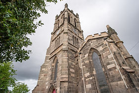 Stone church building with tall tower