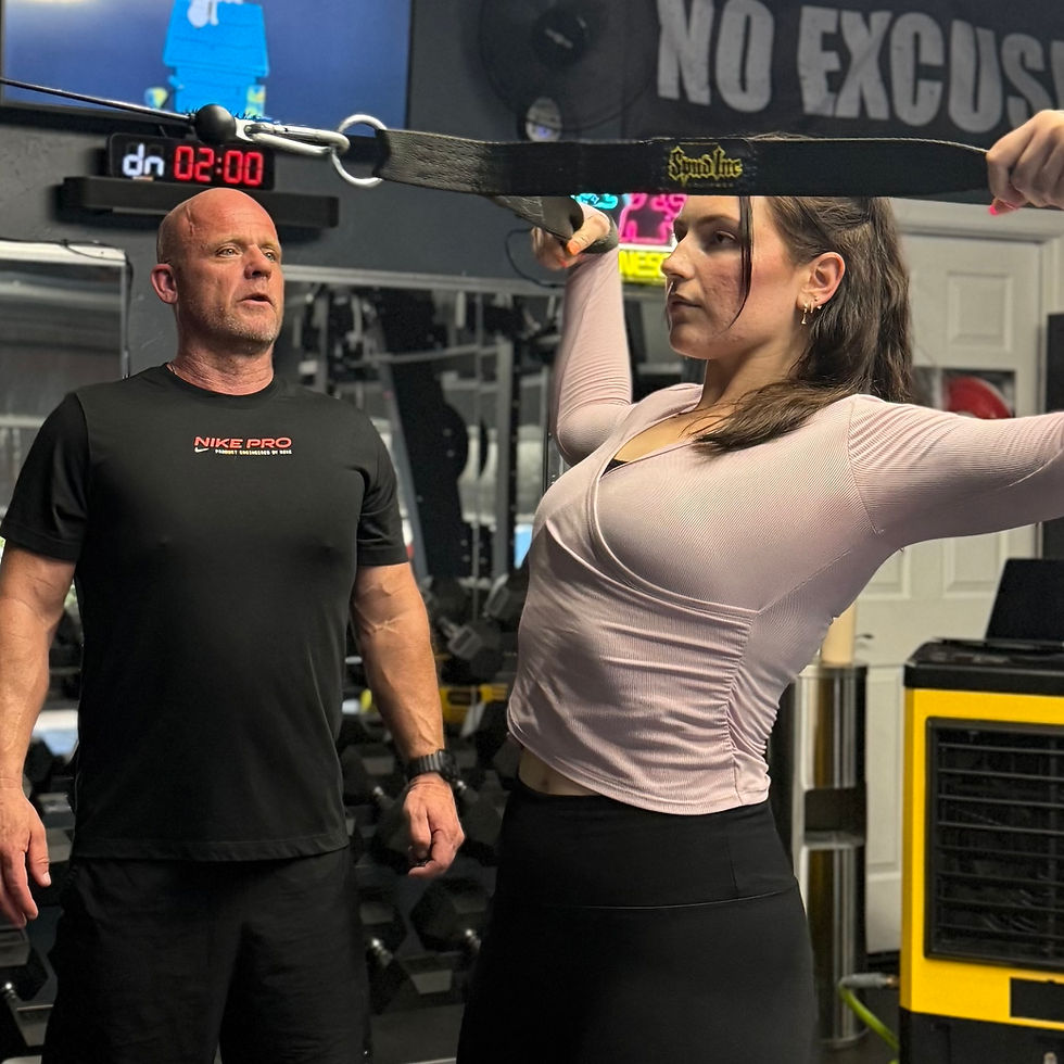 Fitness Coach watching a client perform an exercise
