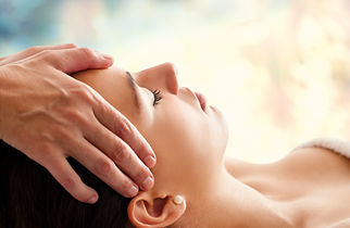 relaxed woman receiving craniosacral therapy