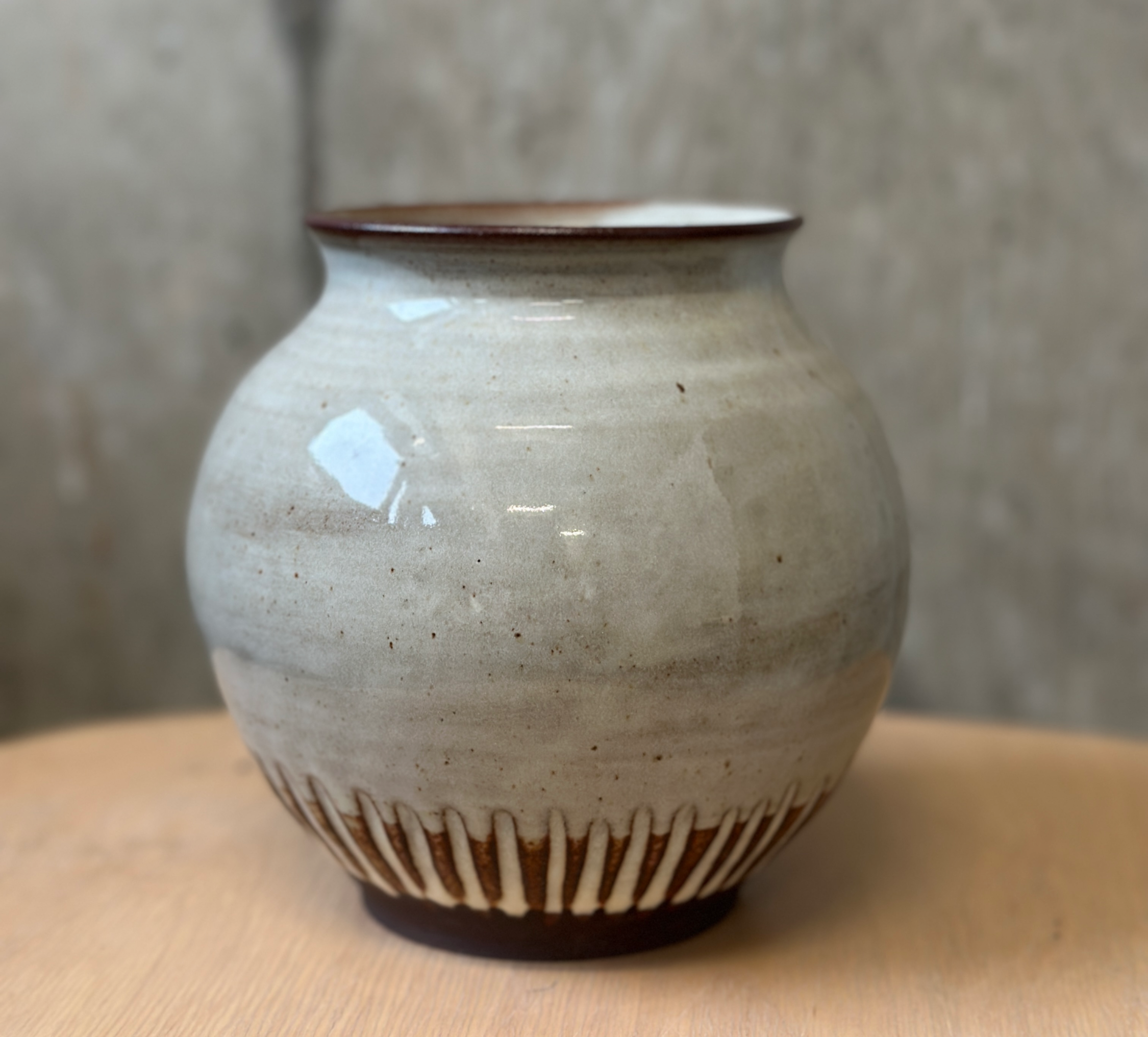 Slipped and carved vase in a dark chocolate clay.