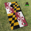 Thumbnail: a set of cornhole boards sitting in grass with a maryland state flag
