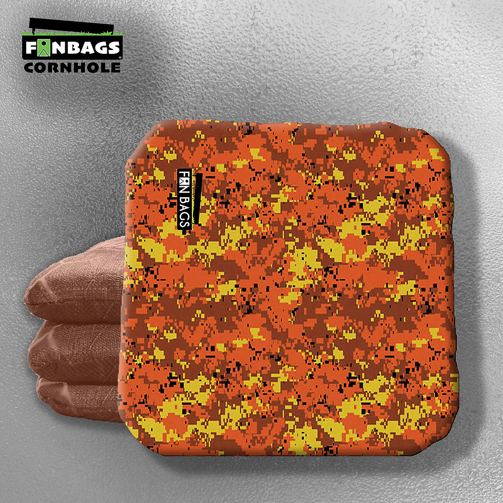 A set of four camouflage-themed cornhole bags laid out on a flat surface, featuring a rugged camo print in green, brown, and