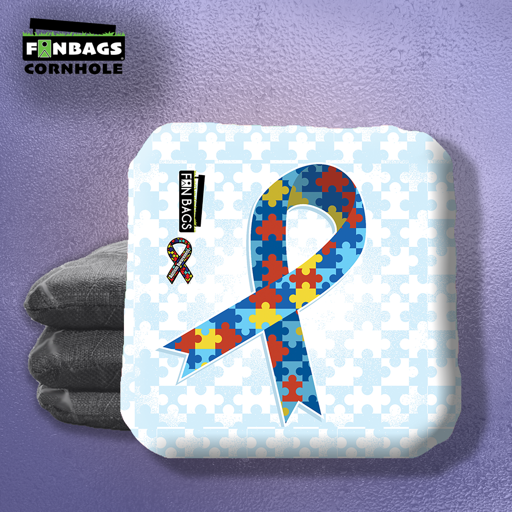 Set of four Autism-themed cornhole bags featuring colorful puzzle piece designs, regulation size, made with durable fabric an