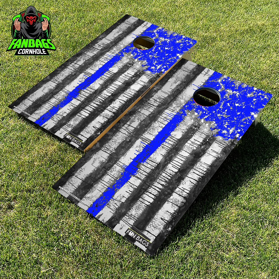 a set of cornhole boards sitting in grass with a thin blue line design