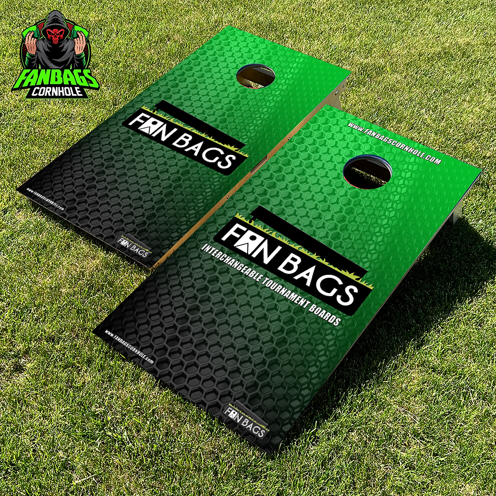 a set of cornhole boards sitting in grass with a green Fanbags logo