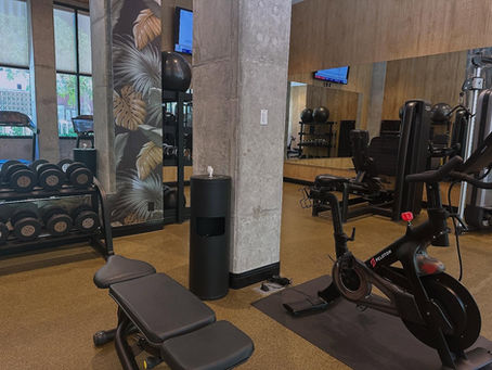 Pilates reformer studio with cleaning wipes available for clients to wipe approved equipment surfaces between classes.