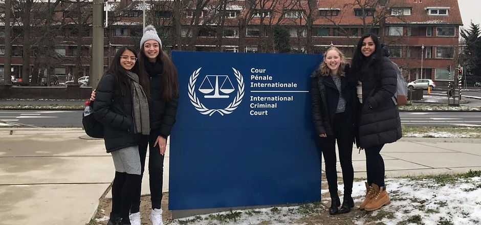 Students stand outside the International Criminal Court in The Hague
