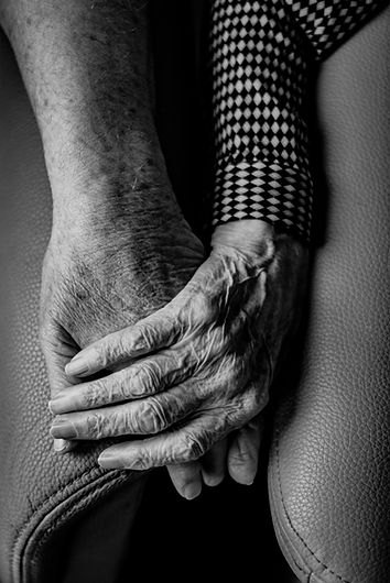 Elderly holding hands
