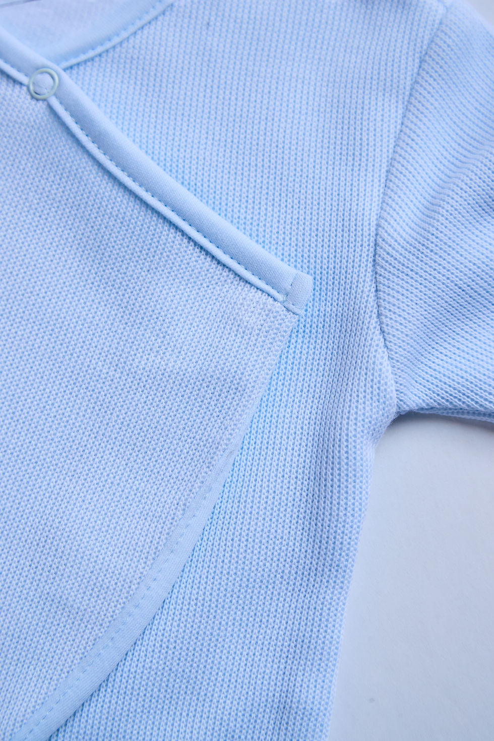 Thumbnail: Zipper and foot detail close-up on Baby Blues Footed Onesie in blue Pima cotton by Gabby Lou Baby