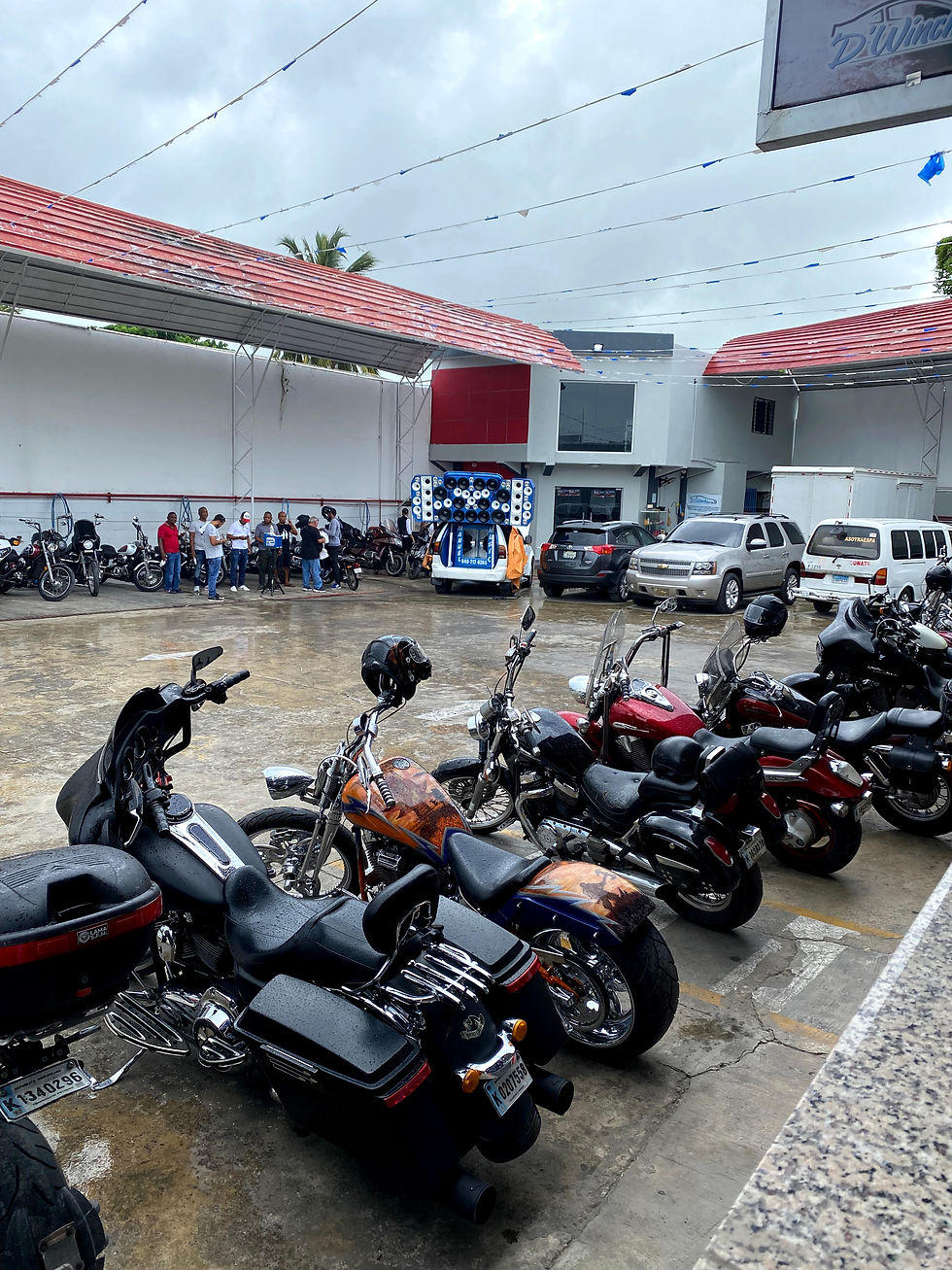 Wide angle view of a group of motorcycles parked outside a roadside diner