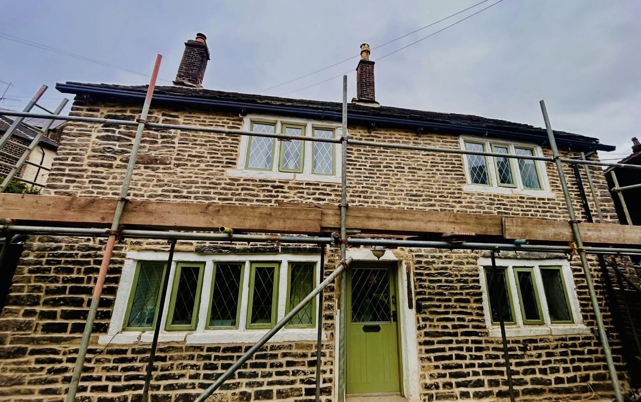 Traditional stone cottage during lime repointing works by G & T Pointing and Restoration