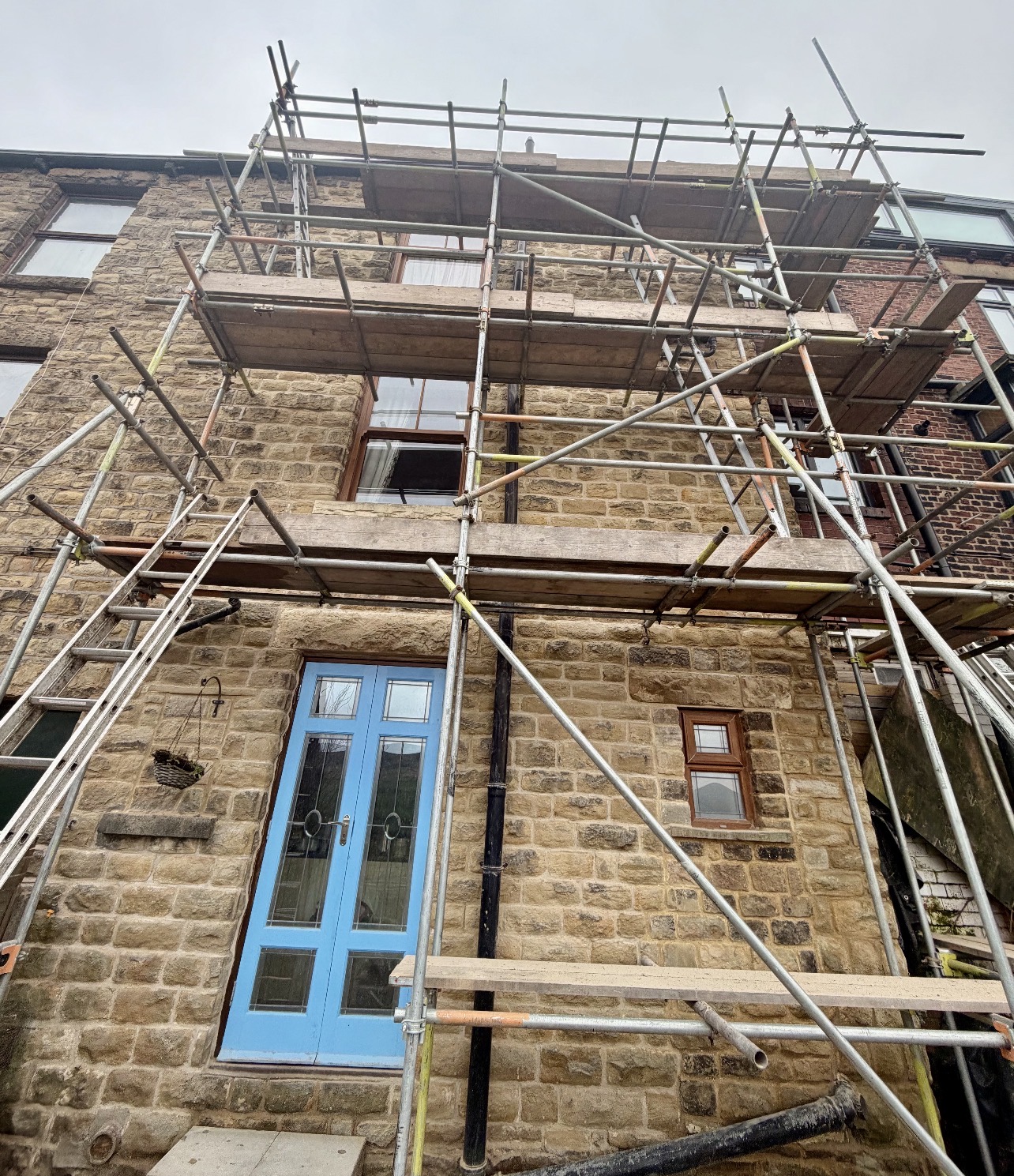 Traditional stone property during repointing works with scaffolding