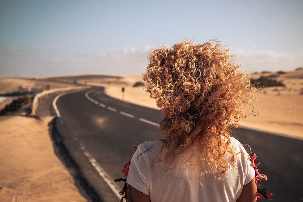 back-view-of-long-blonde-curly-hair-in-the-wind-fo-2021-05-04-00-47-18-utc_edited.jpg