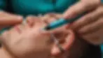 Close-up view of a microsuction device used for ear wax removal