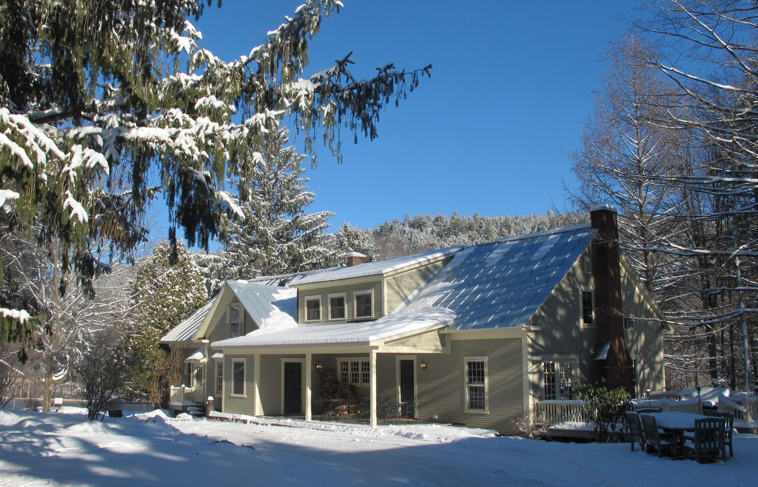 The Featherbed Inn & Nordic Spa with snow on the ground and the roof