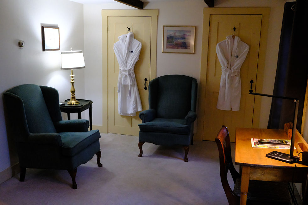 Armchairs and bathrobes in Alexandra room.