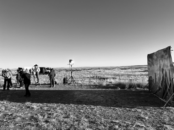 Film crew on location during Boot Barn Westward campaign filming in Marfa Texas across open desert landscape