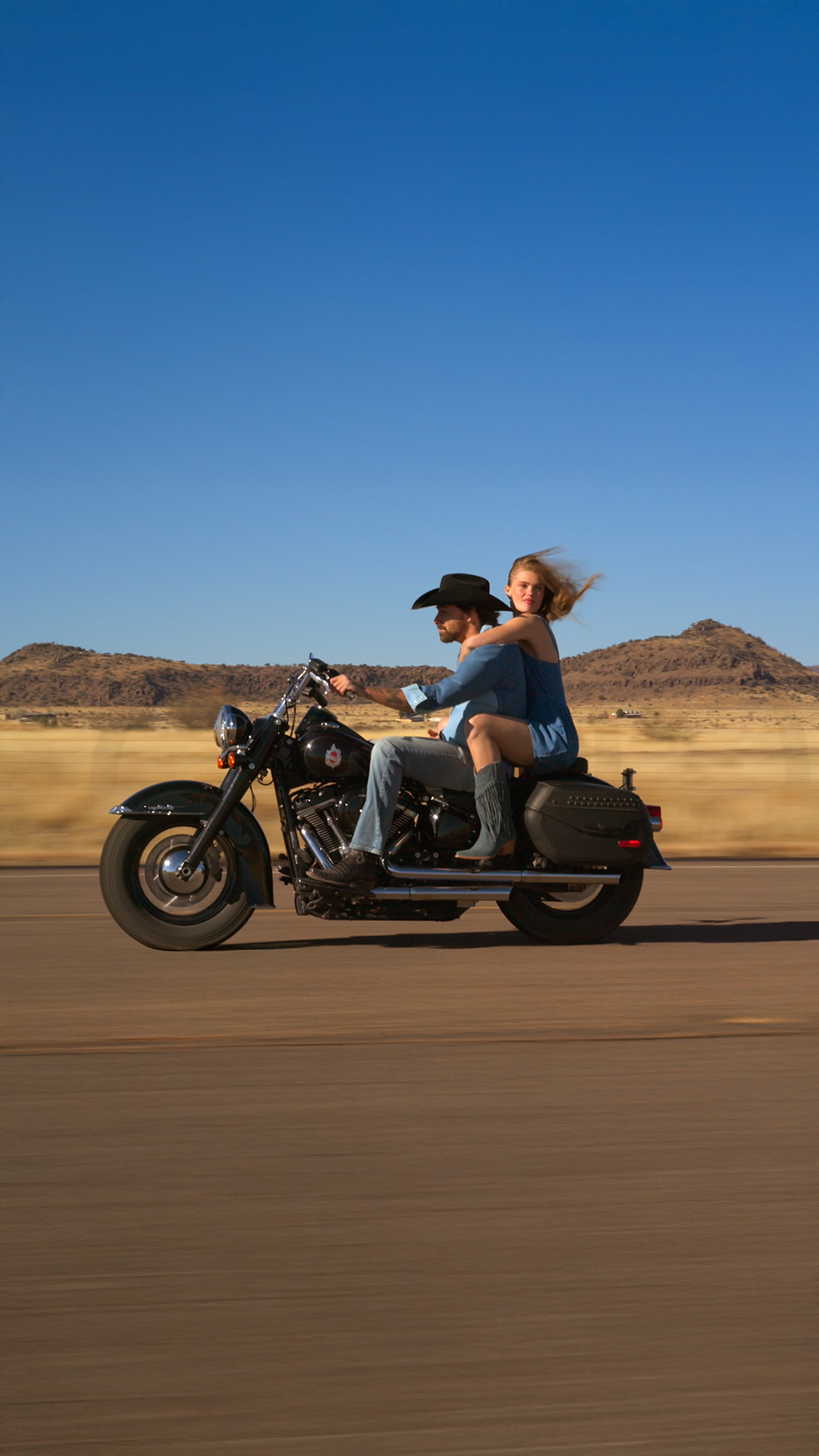 Motorcycle rider captured with Viltrox DL 90mm lens for cinematic aerial compression