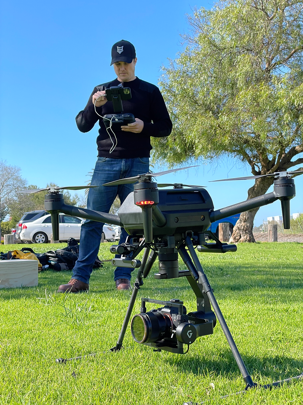 Rob Watt prepares Sony Airpeak S1 with cinema camera for flight on a sunny shoot day