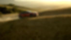 The 2026 Subaru Uncharted EV driving along a winding dirt trail in the golden hills of Santa Rosa at sunset, captured during an adventure campaign shoot.