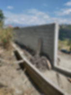 Irrigation canal and upper wall at Casa Libélula home in Malacatos.