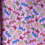 Thumbnail: Orange/Yellow/Green/Blue Lizards on Pink Background 100% Cotton (Woven)