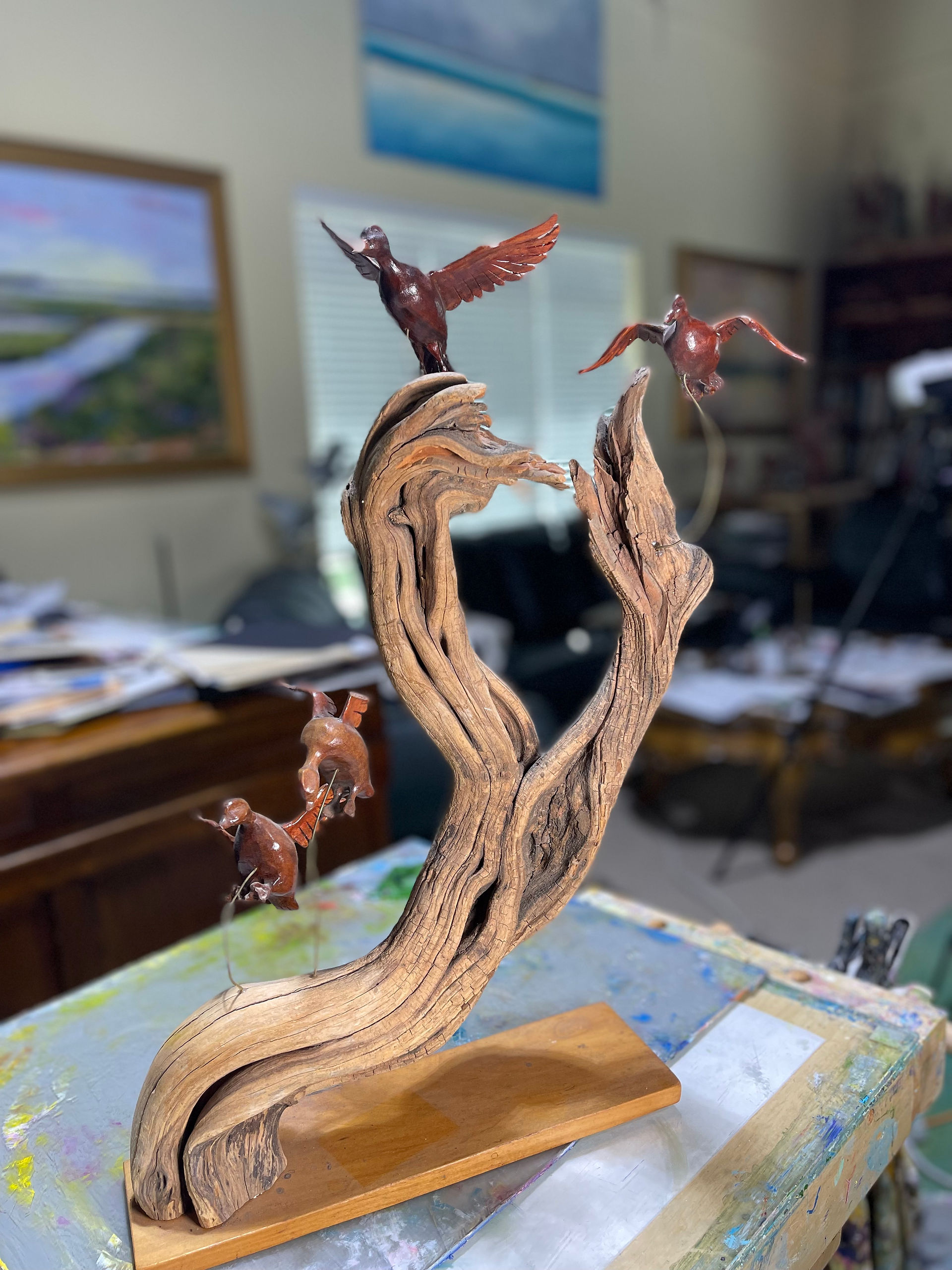 Close-up detail of a hand-carved wildlife art piece by Geoffrey C. Smith.
