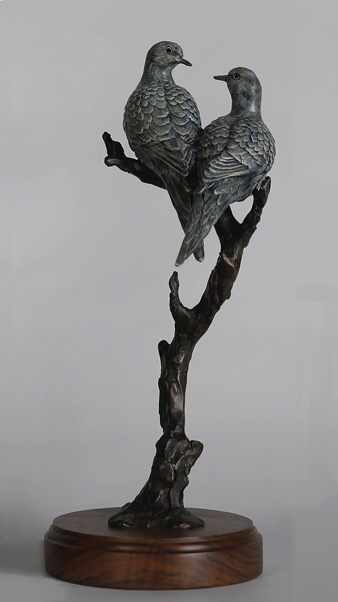 Unity bronze sculpture by Geoffrey Smith depicting two doves resting on a branch
