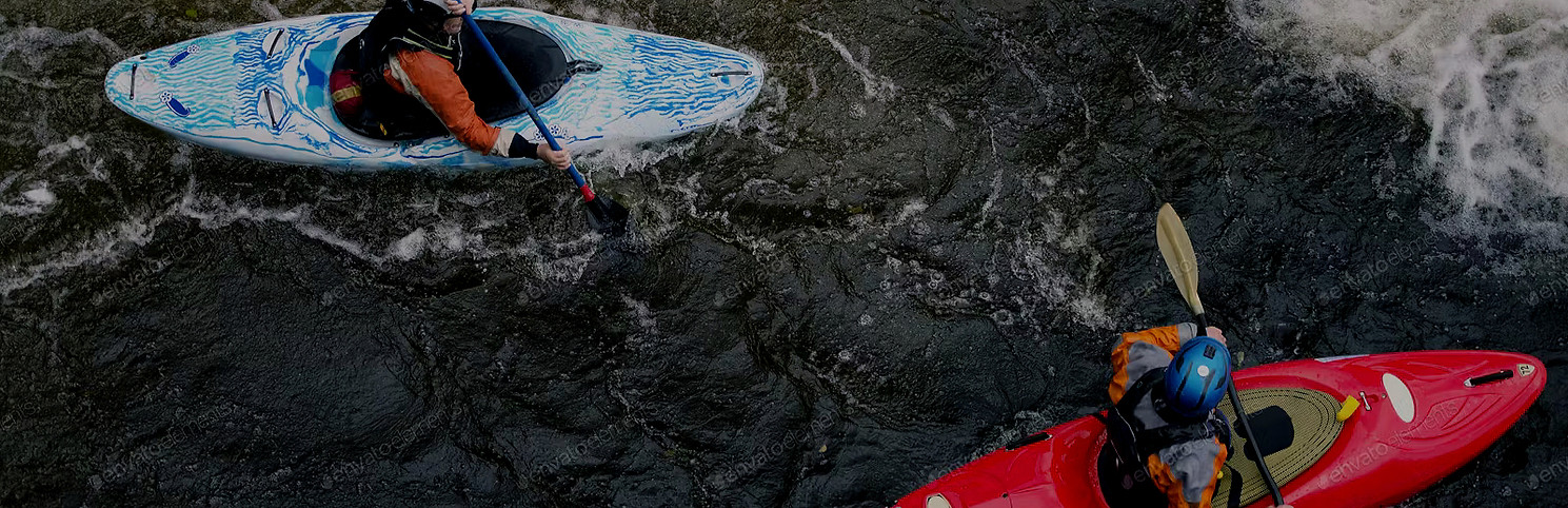 2 people kayaking in the the rapids