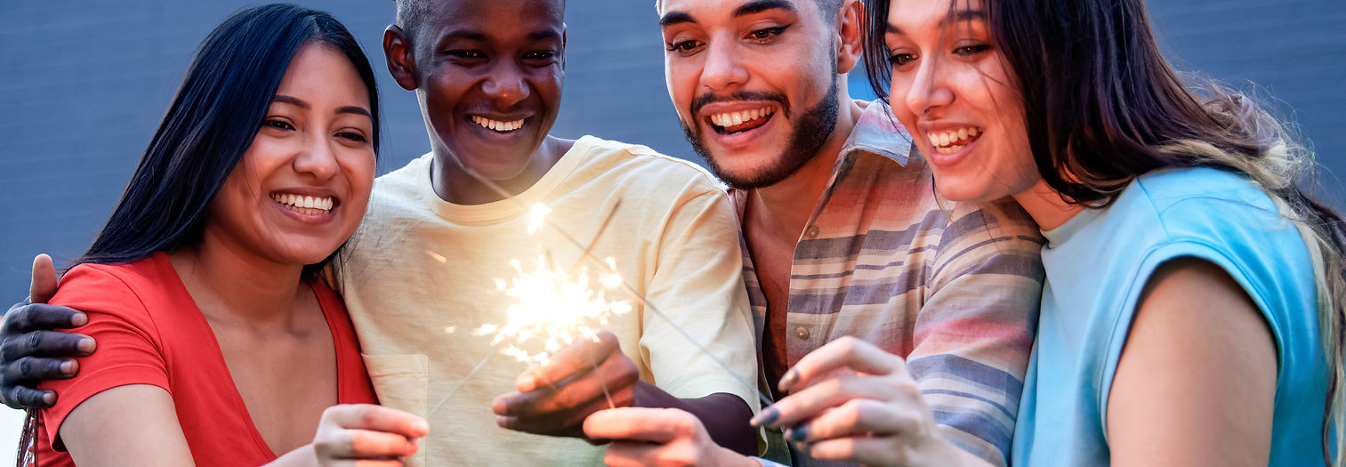 diverse group of-friends having fun with a sparkler
