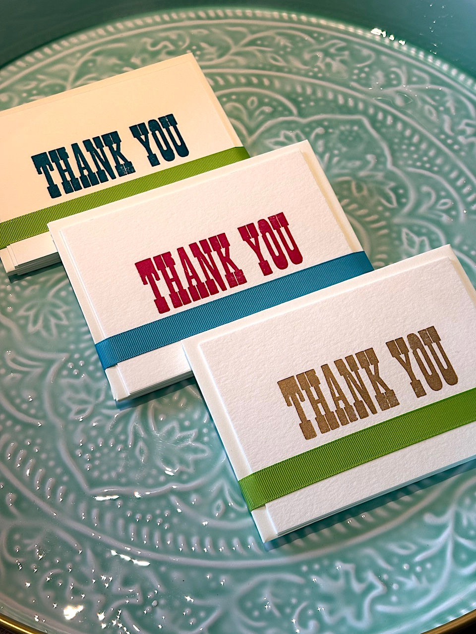 Letterpress thank you cards in gold, blue & magenta