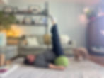 Close-up view of a yoga instructor demonstrating a gentle seated pose