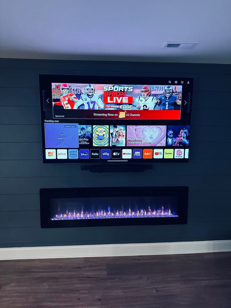TV Installed over an Electric Fireplace custom Build-Out using a Full-Motion wall mount in Cincinnati, OH.