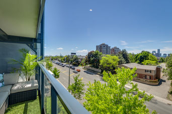 Balcony view of a city street and buildings in Toronto