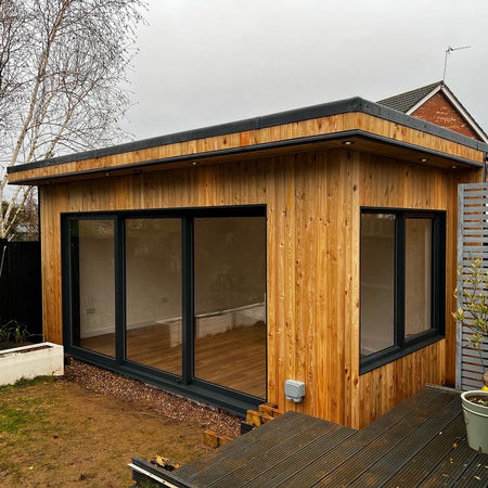 Garden gym with sliding door and Siberian larch cladding in Gamston, Nottingham