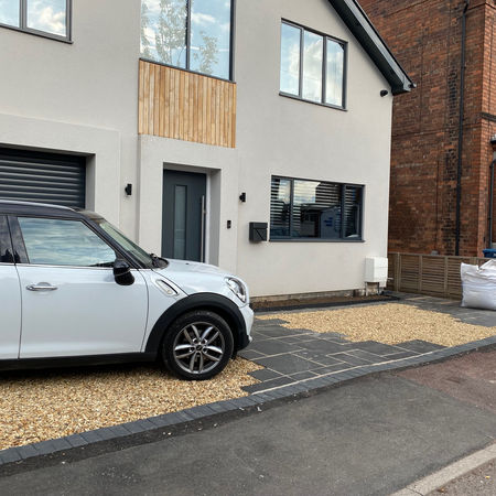 Slate and gravel driveway of contemporary home in Lady Bay, Nottingham