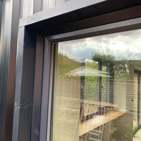 Garden office and cinema room with corrugated steel cladding in a container style in Lady Bay, Nottingham