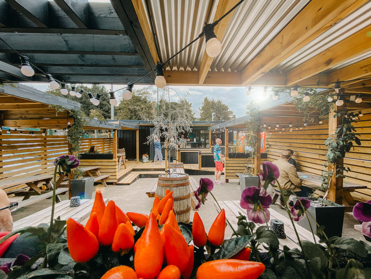 a beer garden with panelling and cladding in the sunshine
