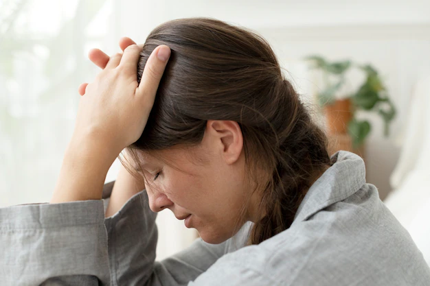 woman-suffering-from-migraine-and-headache_53876-125366.webp