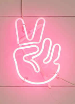 Neon sign of hand holding up two fingers ✌️