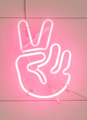 Neon sign holding up two fingers ✌️