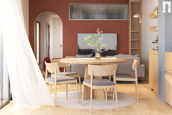 Apartment interior design with round dining table, warm accent wall, open living area, and natural wood furniture