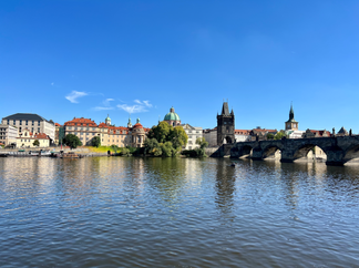 Charles Bridge and the Old Town Bridge Tower - view from Vltava River sightseeing cruise - Prague, Czech Republic
