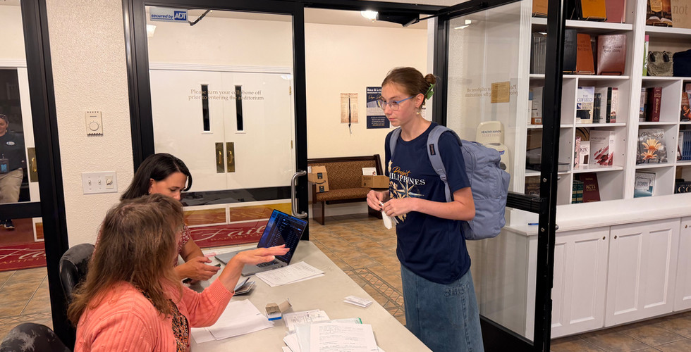 A Project Philippines team member completes the pre-departure check-in at Faith Baptist Church.