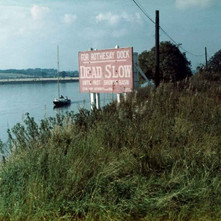 Sign on the Clyde warning ships to slow down passing Brown's basin. - Photo by Tommy Quinn. October 1978