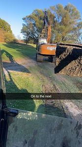 Pond clean-out and excavation at local golf course. Excavation equipment mobilizing to next project site.