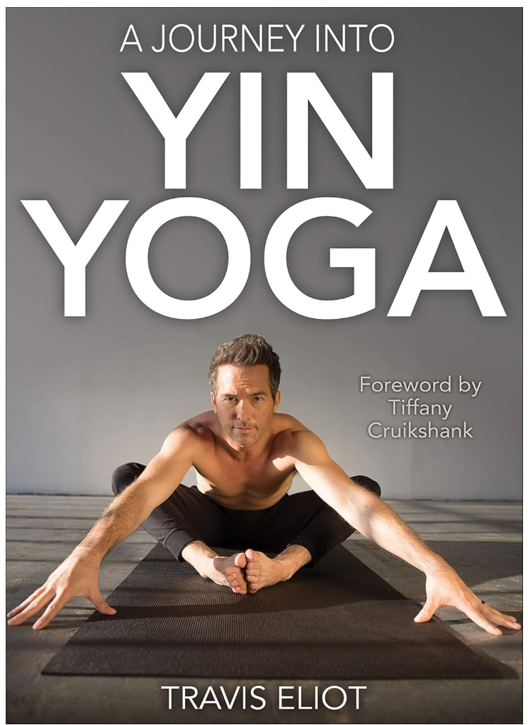 Man performing yoga on mat, stretching forward. Grey background. Text: A Journey Into Yin Yoga, Foreword by Tiffany Cruikshank, Travis Eliot.