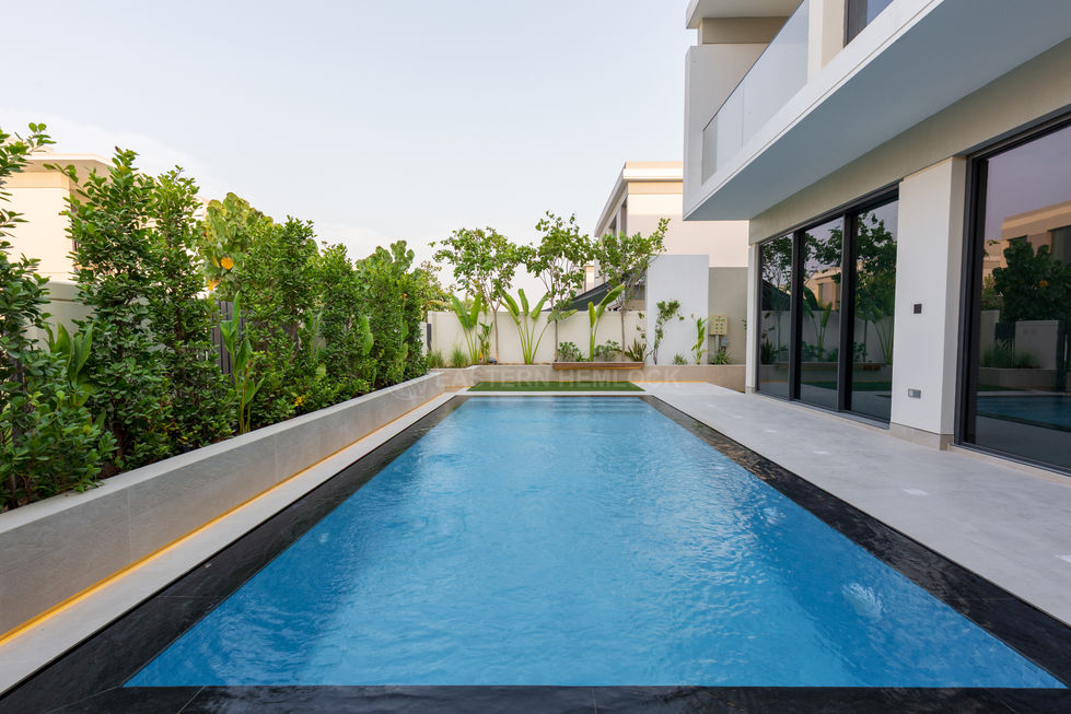 Elegant outdoor pool with landscape design in Dubai villa
