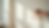 Eye-level view of freshly hung wallpaper being smoothed on a living room wall