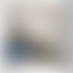 Floating timber shelves mounted on white wall with books and decorative items